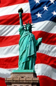 Statue of Liberty superimposed over waving American flag